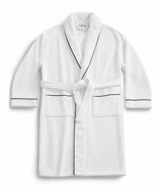 White cotton robe with navy trim and a tied belt.