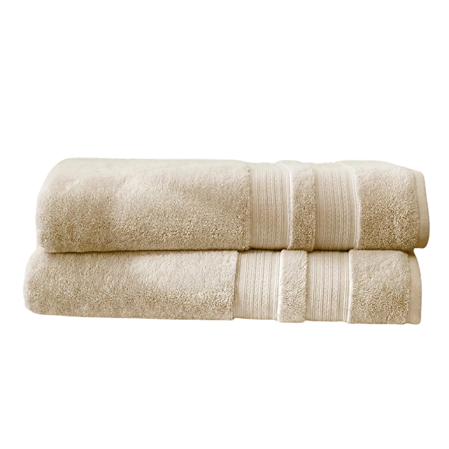 Two plush beige bath sheets folded and stacked, featuring decorative woven border details.