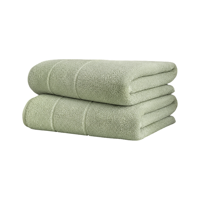 Stack of folded green cotton bath sheets.