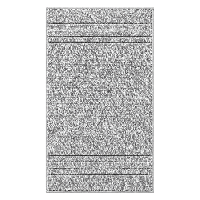 Light grey bath mat with textured stripe details.