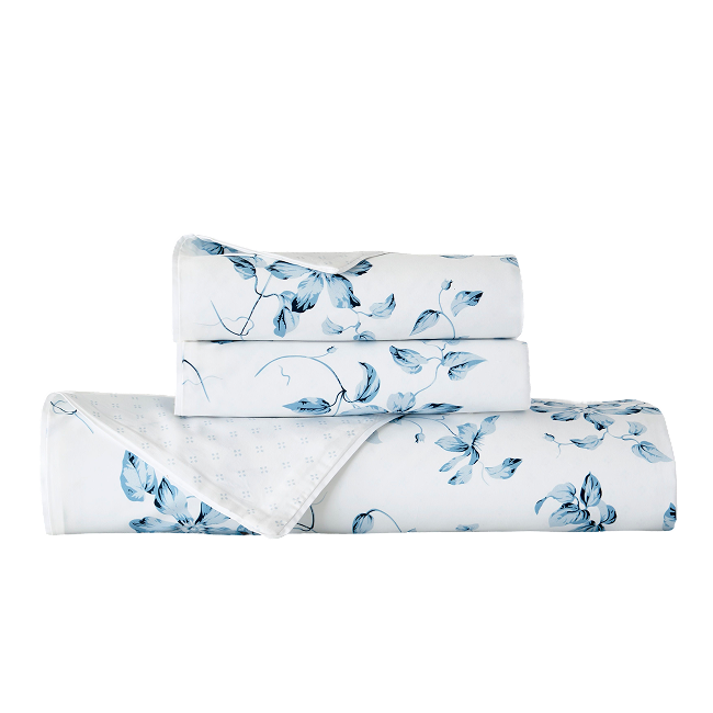 Folded blue floral duvet cover set.