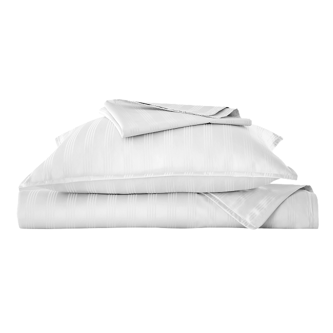 White striped duvet cover set with matching pillow sham and sheets folded.