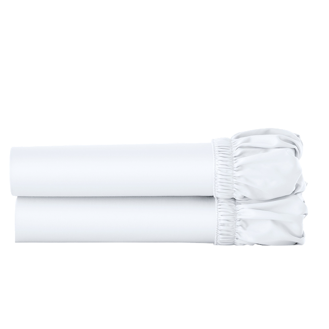 Two white cotton fitted sheets folded and stacked.