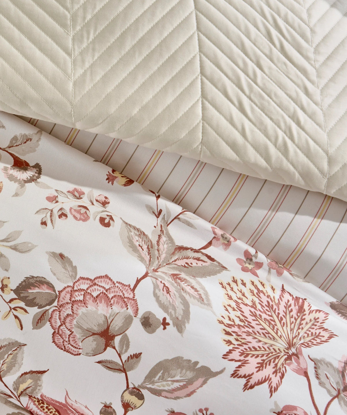 Close-up of the pink floral print and coordinating striped reverse.