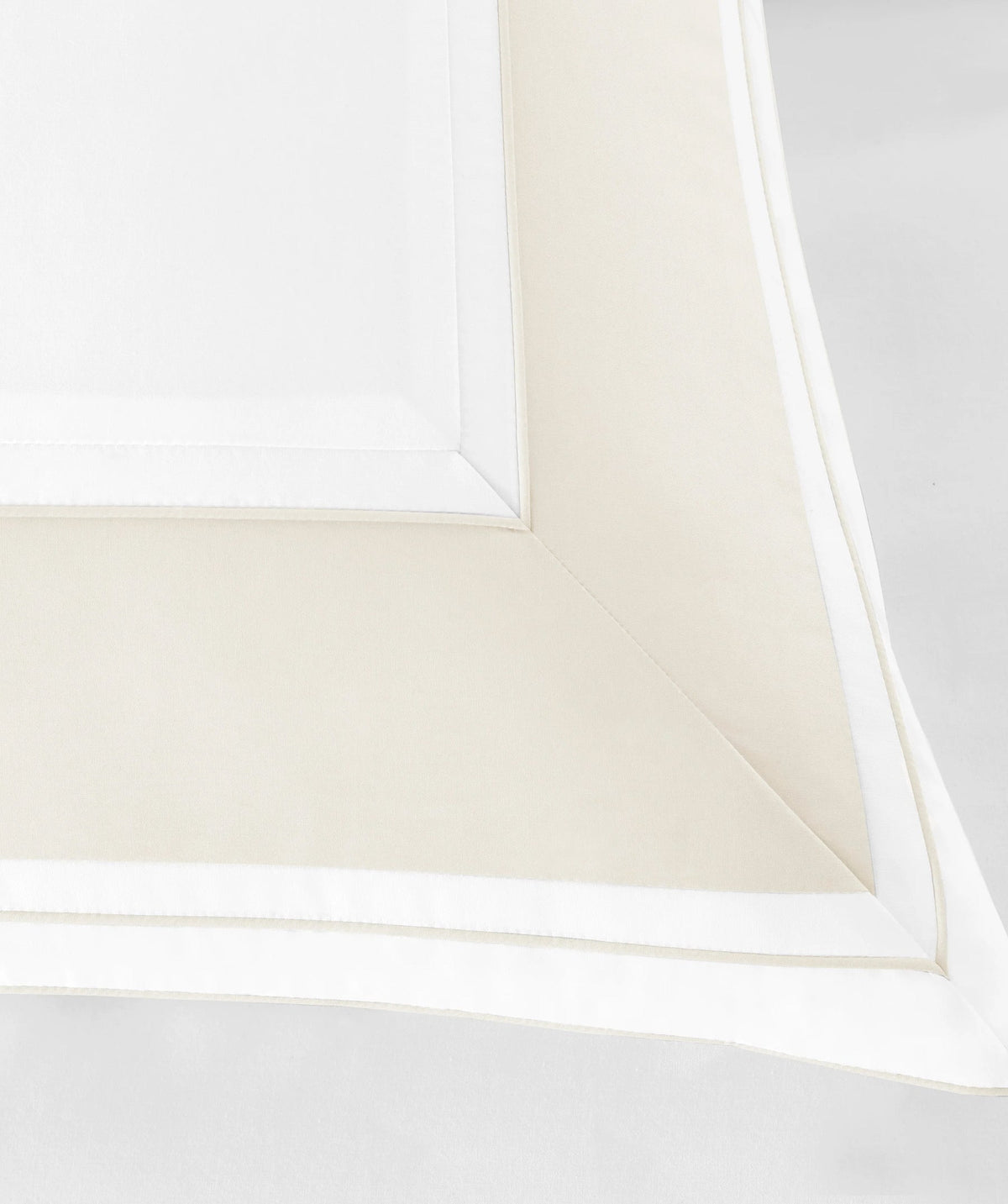 Close-up of white border pillow sham detail.