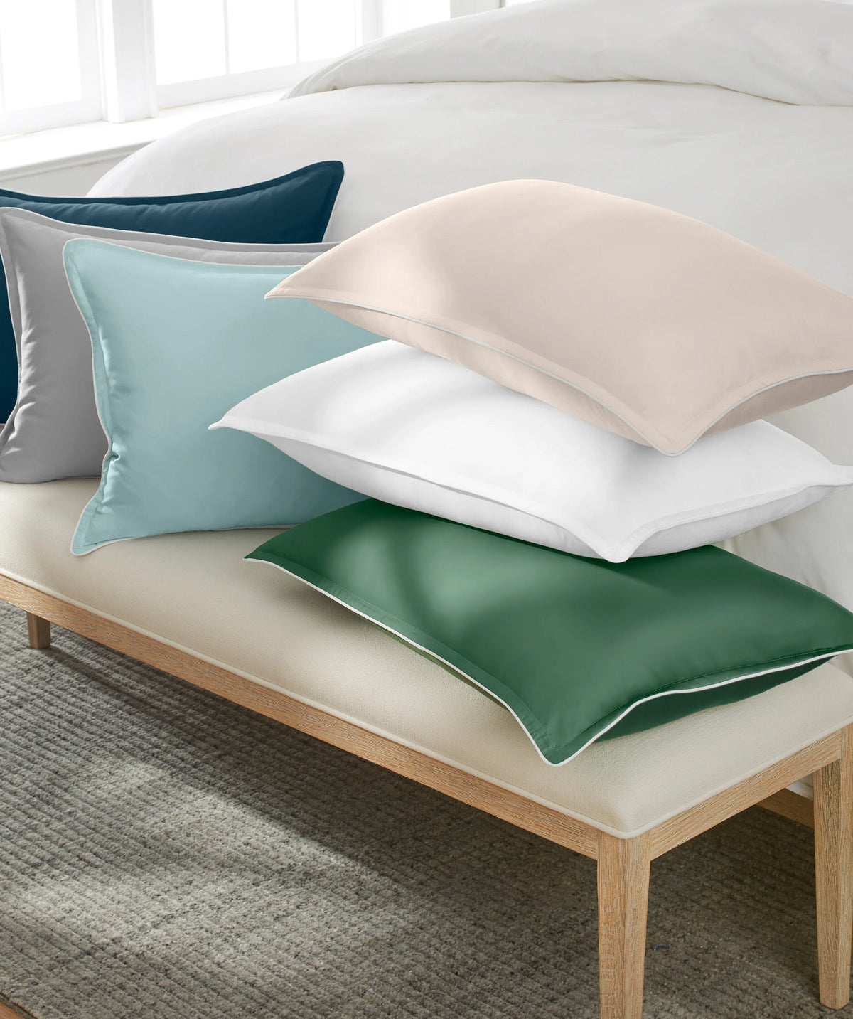 Supreme Comfort bolster pillows available in multiple colors.