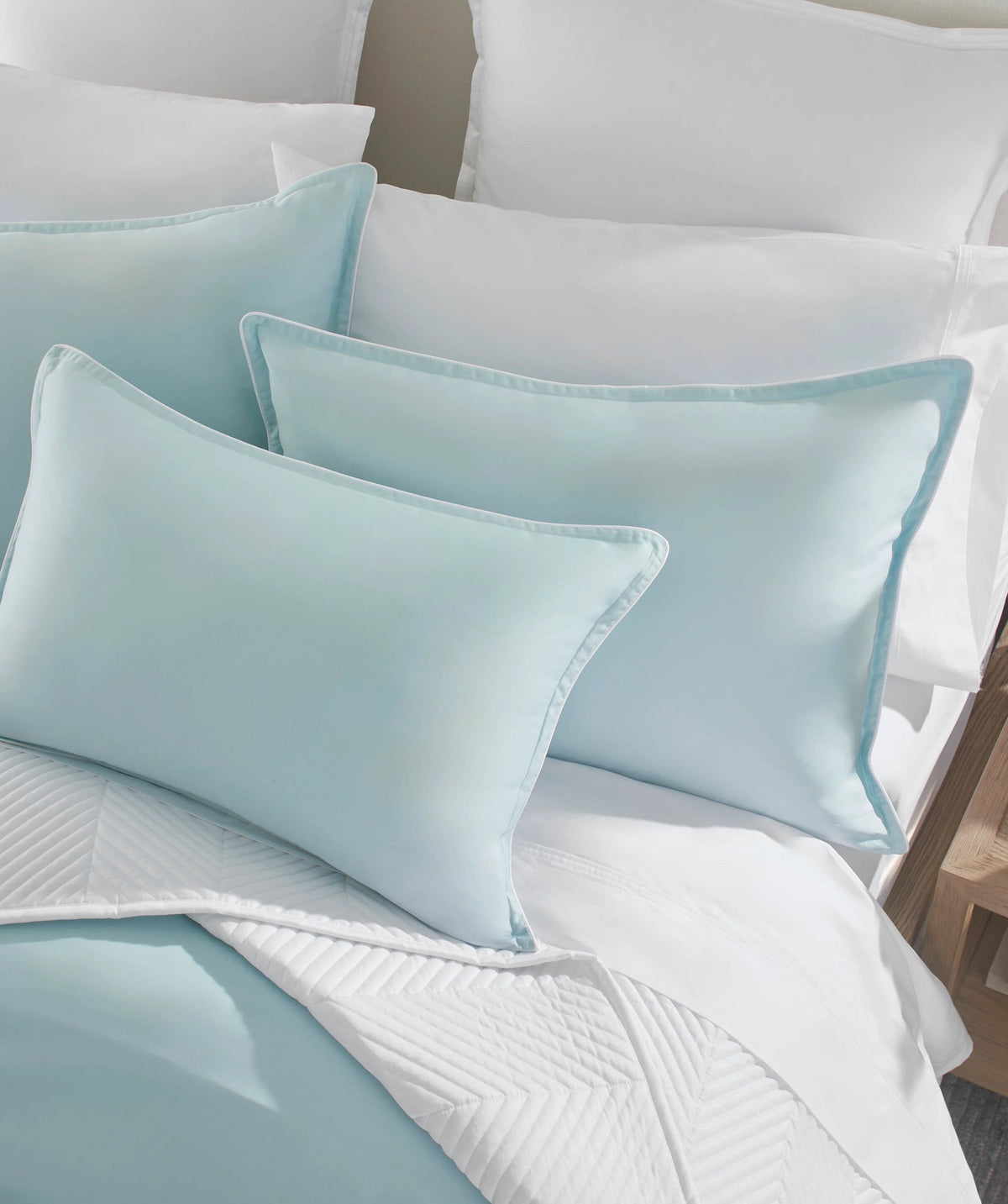 Pastel blue solid duvet cover set styled on a bed.