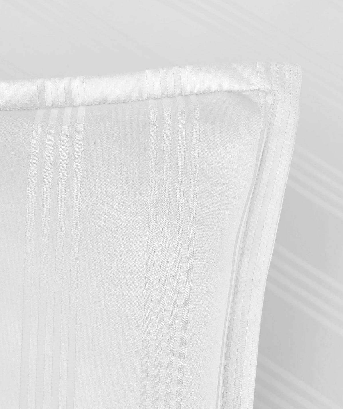 Close-up of a white striped Euro sham with tonal stripe pattern.