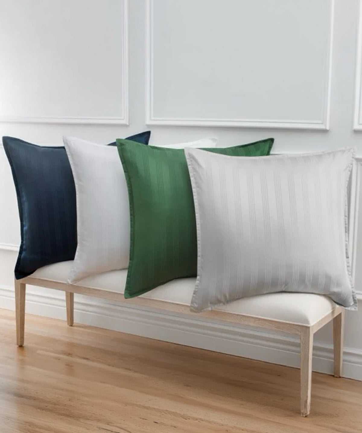 Striped Euro shams displayed with blue, white, green, and grey color options.