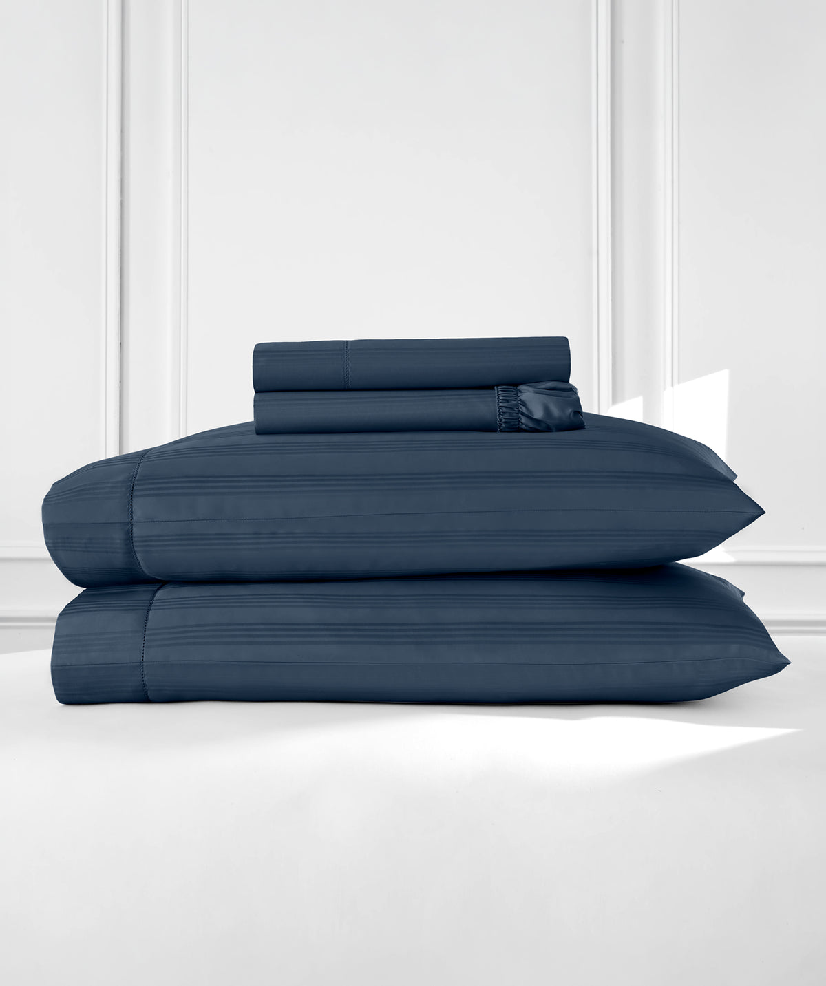 Supreme Egyptian Cotton Striped Sheet Set folded and stacked with its pillowcases
