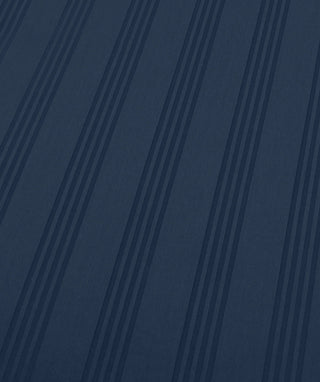 A close-up of a dark navy blue textured material with vertical pinstripes.