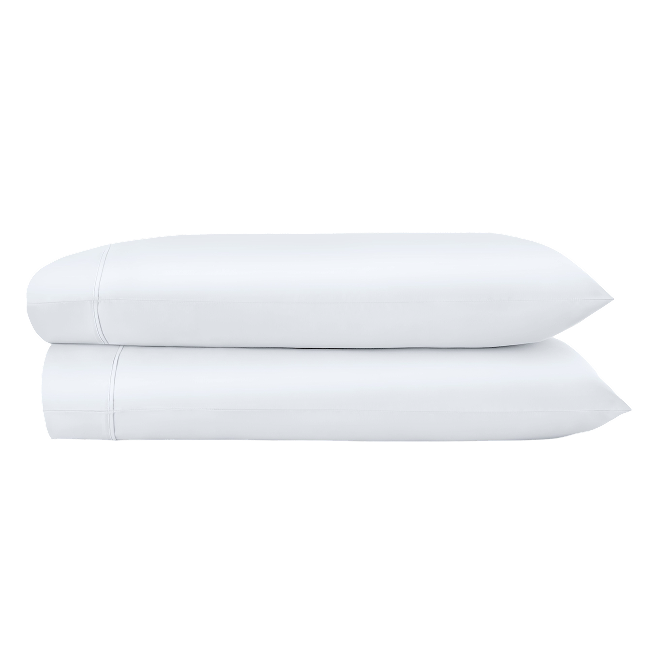 Two white pillowcases folded and stacked.  
