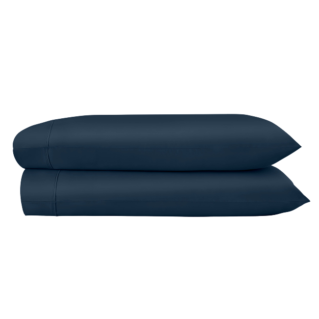 Two navy pillowcases folded and stacked.  