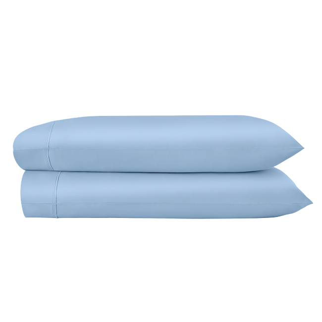 Two powder blue pillowcases folded and stacked.  