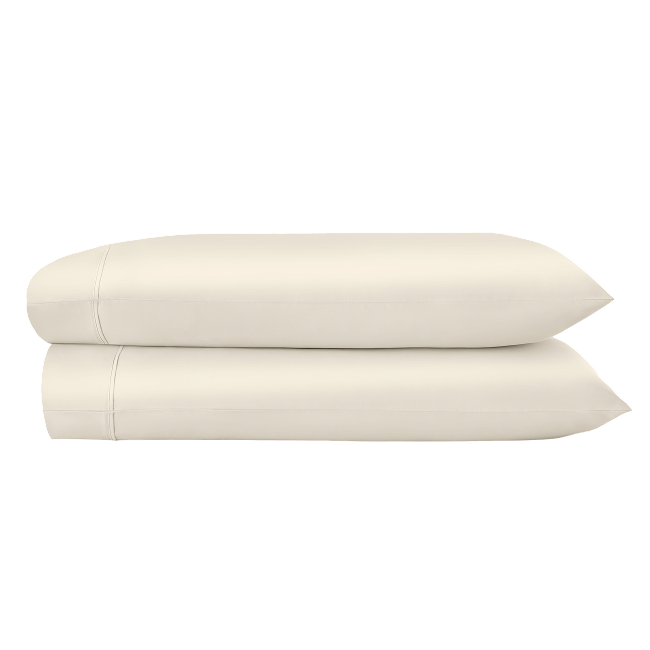 Two ivory pillowcases folded and stacked.  