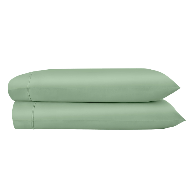 Two green pillowcases folded and stacked.  