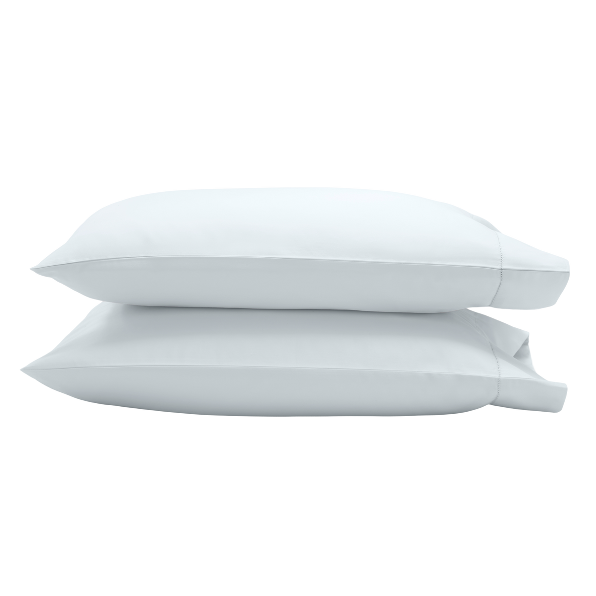 Two white pillowcases stacked on top of each other.