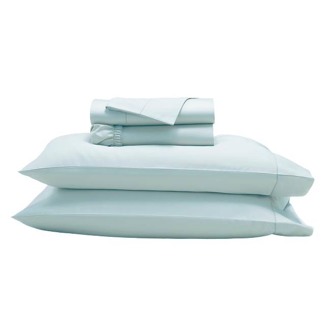Folded pastel blue sheet set with and pillowcases stacked together.  