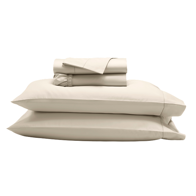 Folded beige sheet set with and pillowcases stacked together.  